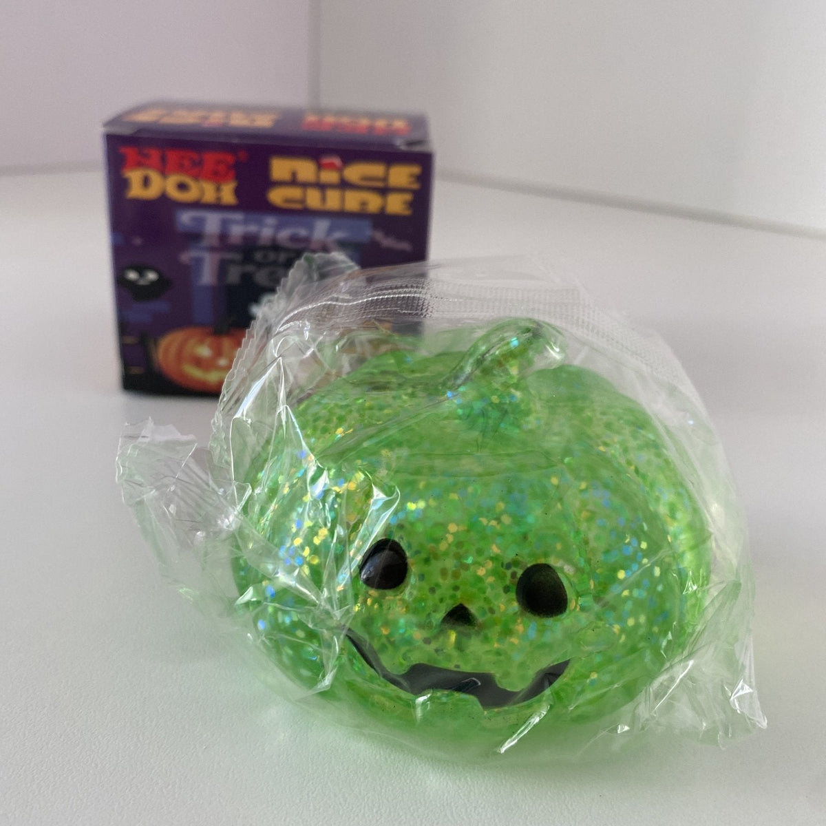 Squishy NeeDoh Nice Cube citrouille maltose pailletée CLADEA